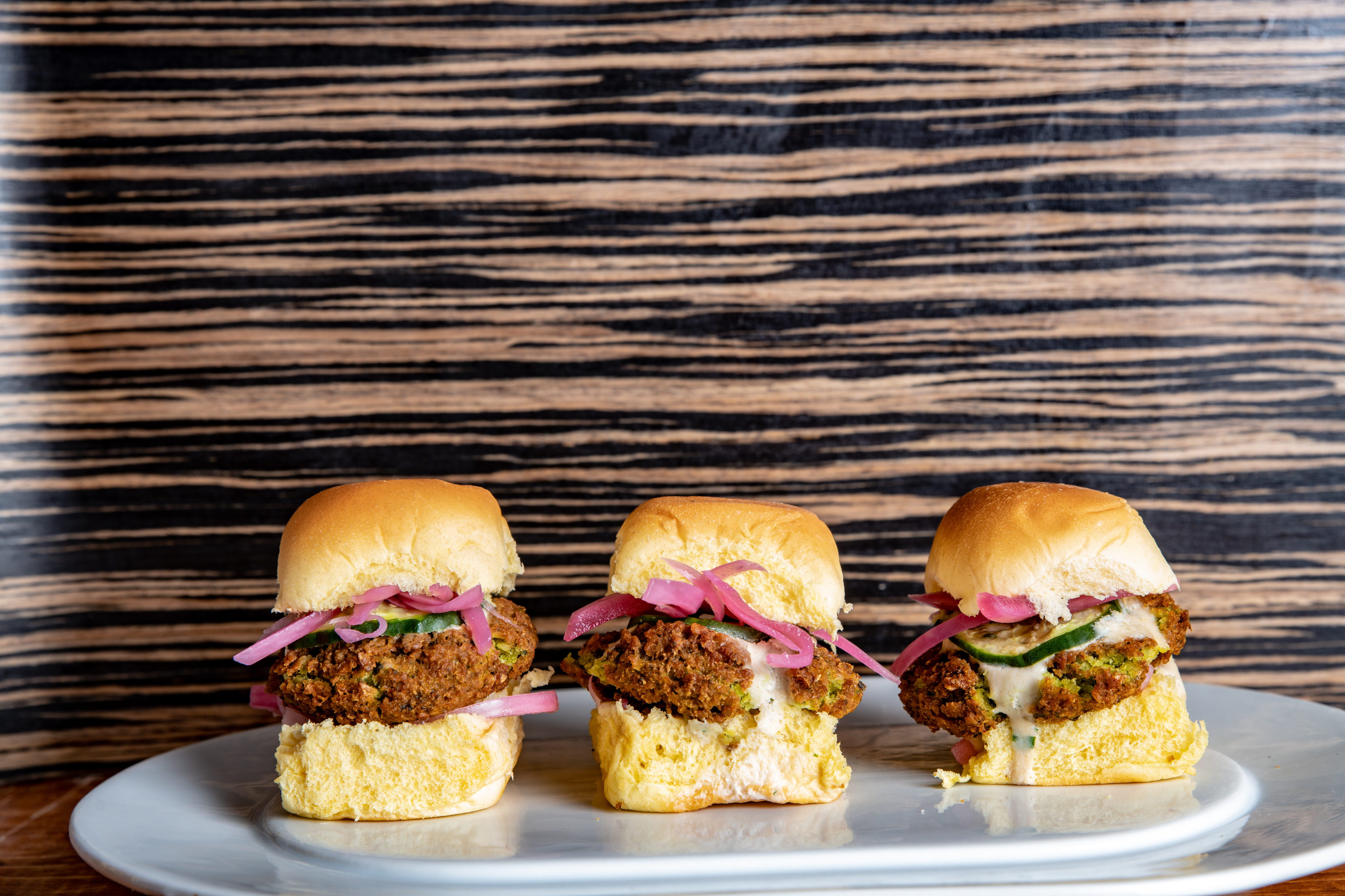 Falafel sliders, pickled vegetables, housemade sauce