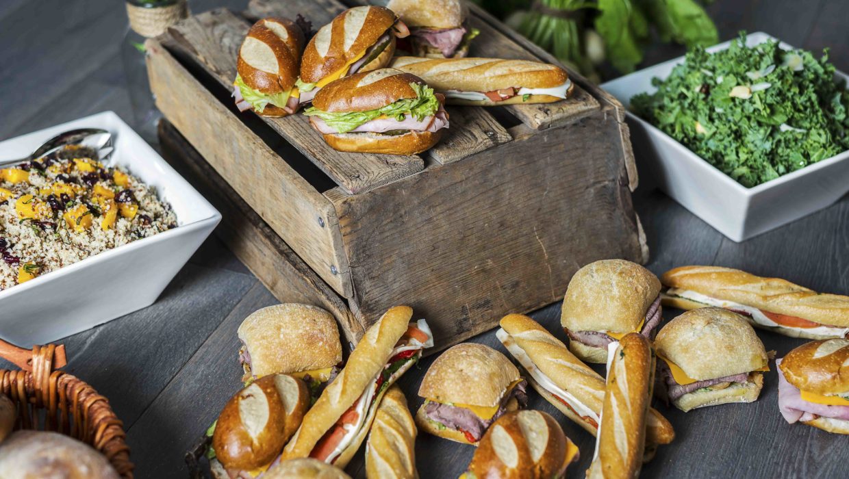 Large sandwiches and family style salads